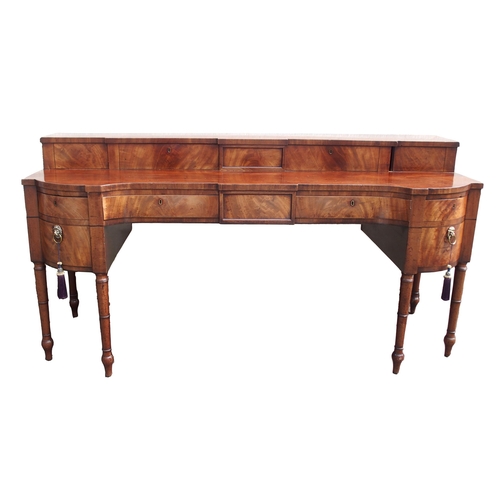 819 - A GEORGIAN MAHOGANY SERPENTINE SIDEBOARD