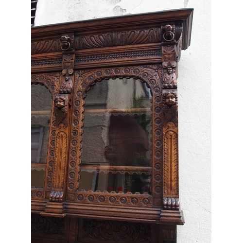 821 - A CONTINENTAL OAK DISPLAY SIDEBOARD