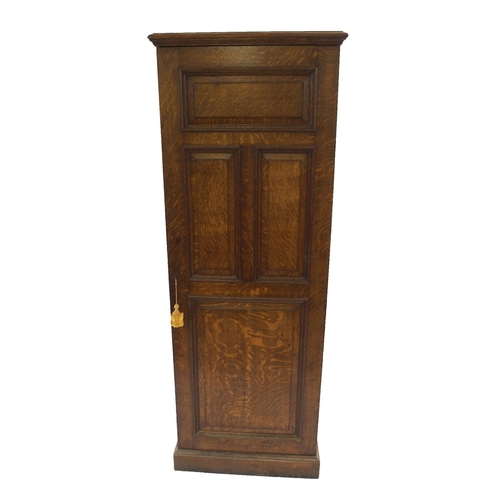 830 - AN EDWARDIAN OAK PANELLED CUPBOARD