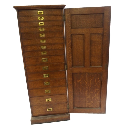 830 - AN EDWARDIAN OAK PANELLED CUPBOARD