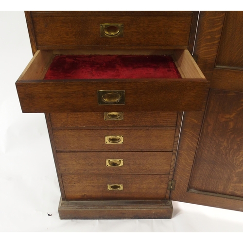 830 - AN EDWARDIAN OAK PANELLED CUPBOARD