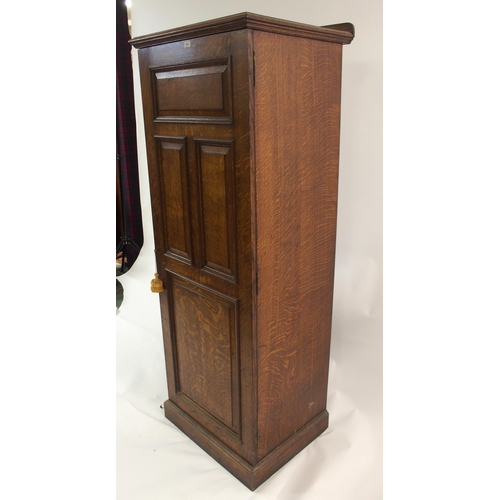 830 - AN EDWARDIAN OAK PANELLED CUPBOARD