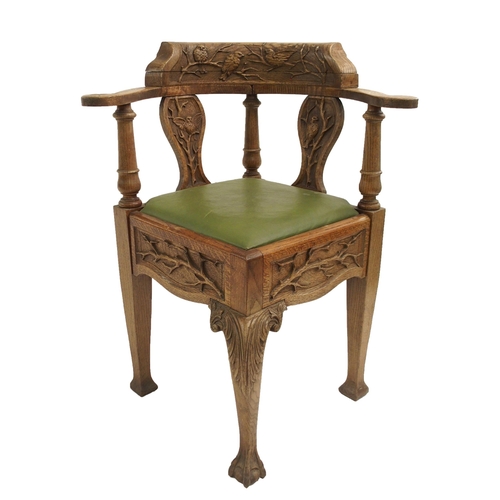 832 - AN ARTS AND CRAFTS OAK CORNER ARMCHAIR