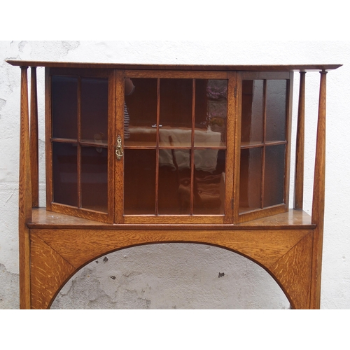 839 - AN ARTS AND CRAFTS OAK DISPLAY CABINET