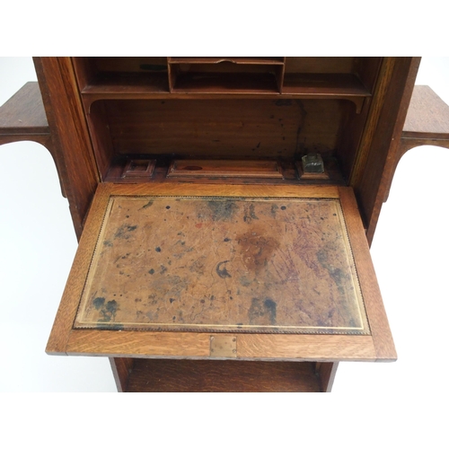 841 - AN ARTS AND CRAFTS OAK WRITING DESK