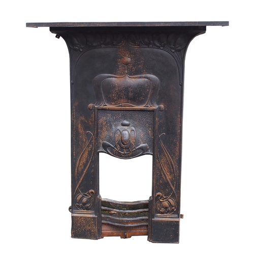 842 - AN ARTS AND CRAFTS CAST IRON FIRE SURROUND