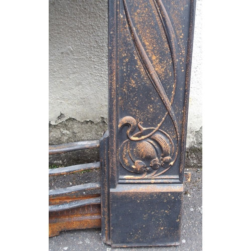 842 - AN ARTS AND CRAFTS CAST IRON FIRE SURROUND