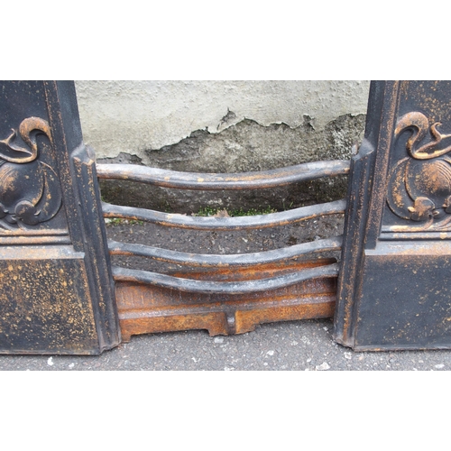 842 - AN ARTS AND CRAFTS CAST IRON FIRE SURROUND