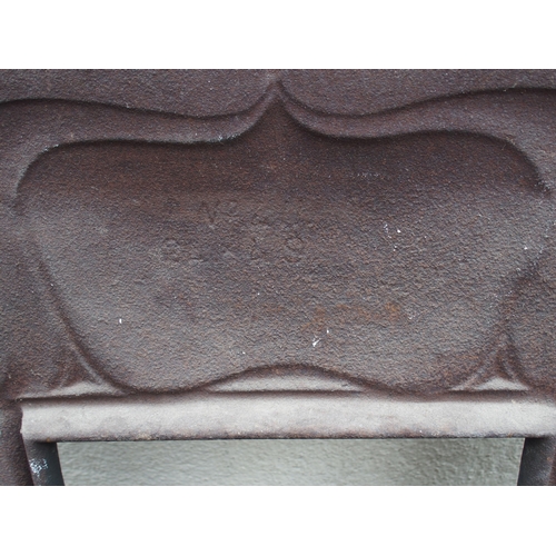 842 - AN ARTS AND CRAFTS CAST IRON FIRE SURROUND