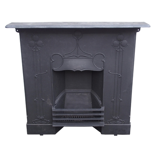 843 - AN ARTS AND CRAFTS CAST IRON FIRE SURROUND