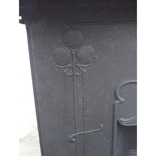 843 - AN ARTS AND CRAFTS CAST IRON FIRE SURROUND