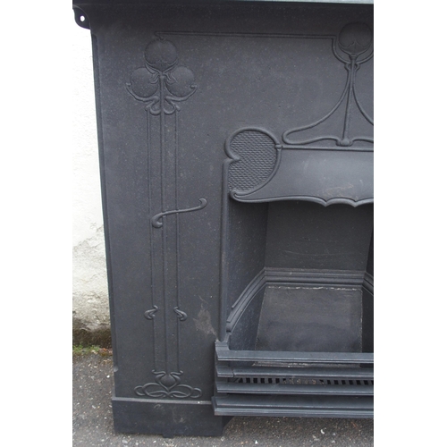 843 - AN ARTS AND CRAFTS CAST IRON FIRE SURROUND