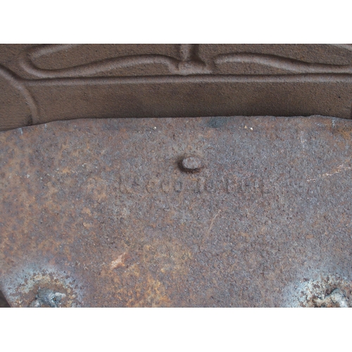 843 - AN ARTS AND CRAFTS CAST IRON FIRE SURROUND