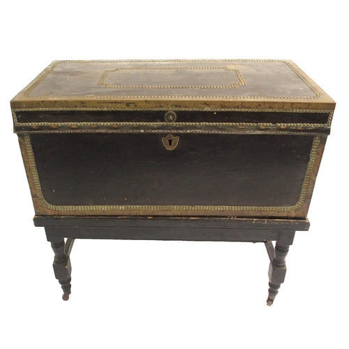 846 - A NAVAL LEATHER BOUND AND BRASS MOUNTED CAMPHORWOOD TRUNK