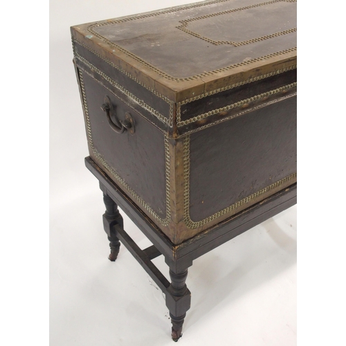 846 - A NAVAL LEATHER BOUND AND BRASS MOUNTED CAMPHORWOOD TRUNK