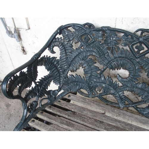 853 - A CAST IRON FERN PATTERN GARDEN BENCH