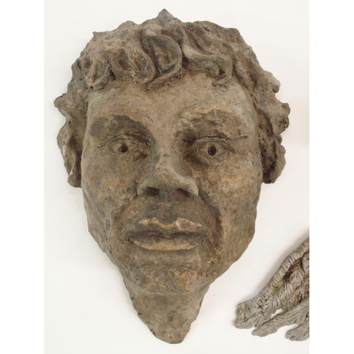 855 - A CAST METAL HEAD OF A YOUNG MAN