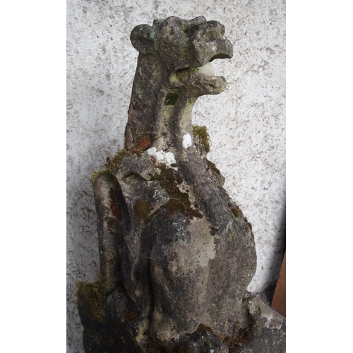 857 - A PAIR OF CARVED SANDSTONE RAIN WATER SPOUTS IN THE FORM OF GRIFFINS