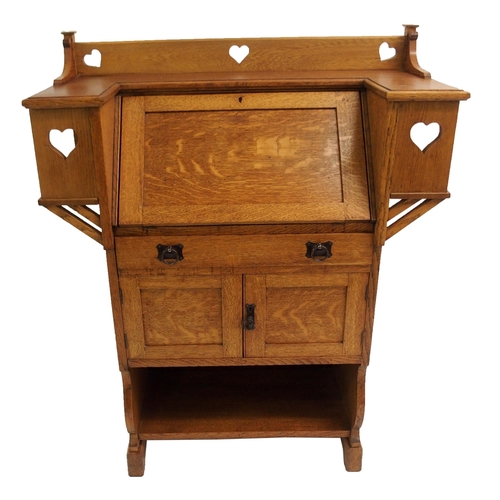 858 - AN ARTS AND CRAFTS OAK WRITING DESK