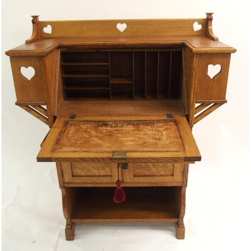 858 - AN ARTS AND CRAFTS OAK WRITING DESK