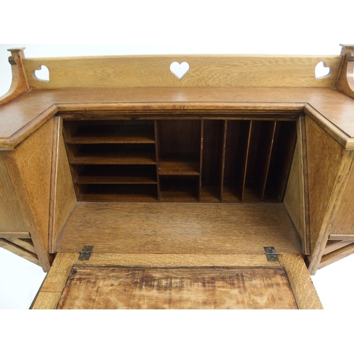 858 - AN ARTS AND CRAFTS OAK WRITING DESK