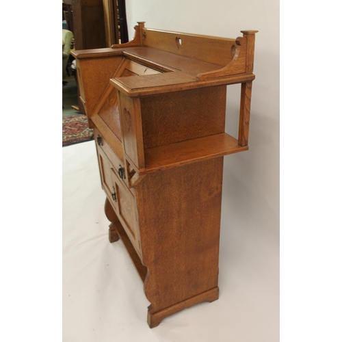 858 - AN ARTS AND CRAFTS OAK WRITING DESK