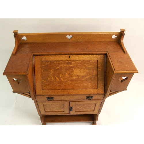 858 - AN ARTS AND CRAFTS OAK WRITING DESK