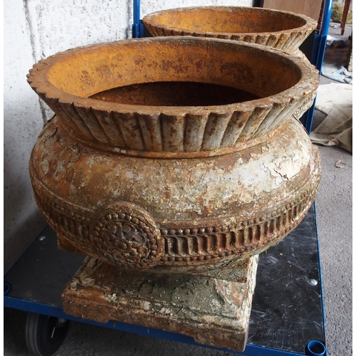 861 - A PAIR OF CAST IRON THISTLE SHAPED GARDEN URNS