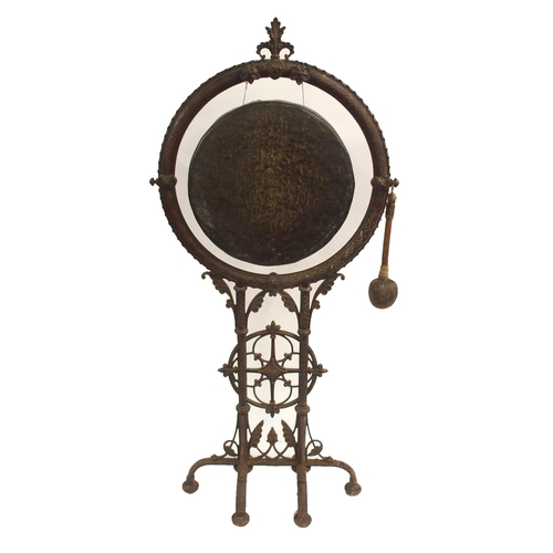 879 - A VICTORIAN CAST IRON GONG AND STAND