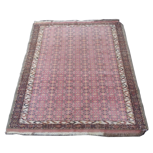 881 - AN EASTERN PINK GROUND RUG