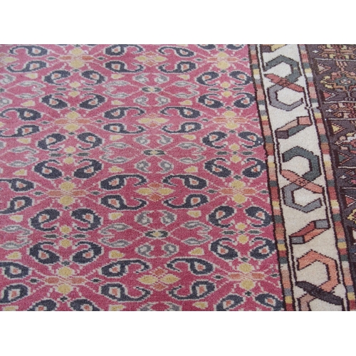 881 - AN EASTERN PINK GROUND RUG