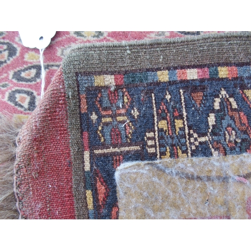 881 - AN EASTERN PINK GROUND RUG