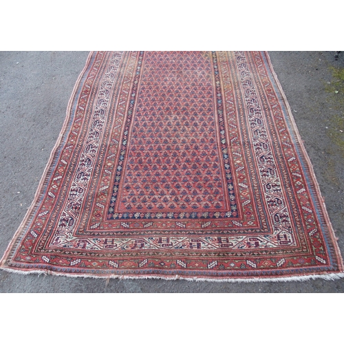 883 - AN ARAAK RED GROUND RUG