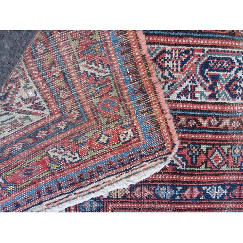 883 - AN ARAAK RED GROUND RUG