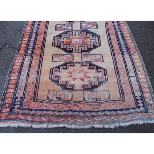 883 - AN ARAAK RED GROUND RUG