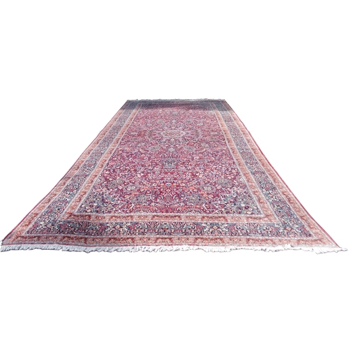 884 - AN EASTERN RED GROUND RUG