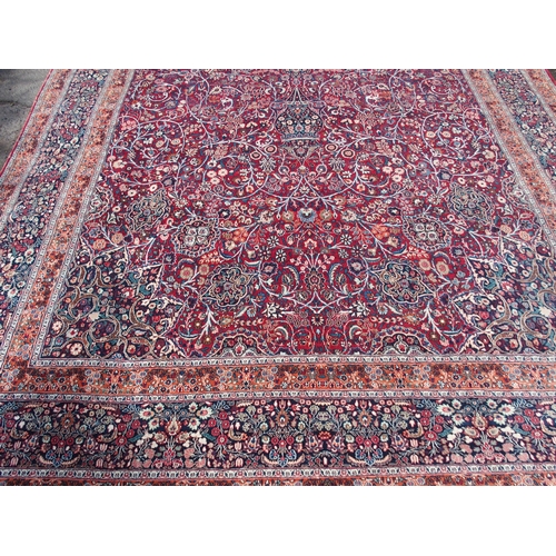 884 - AN EASTERN RED GROUND RUG