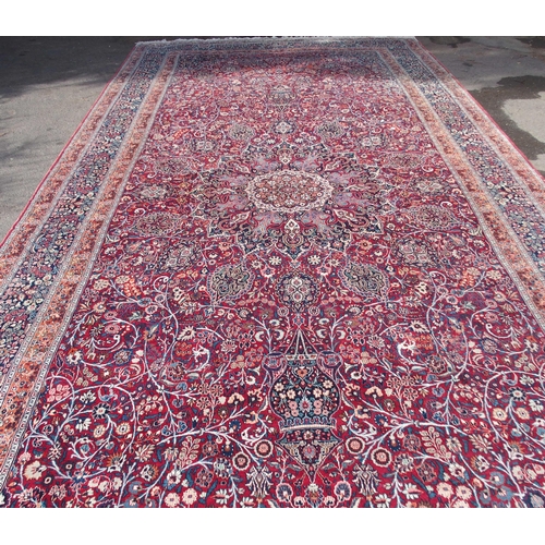 884 - AN EASTERN RED GROUND RUG