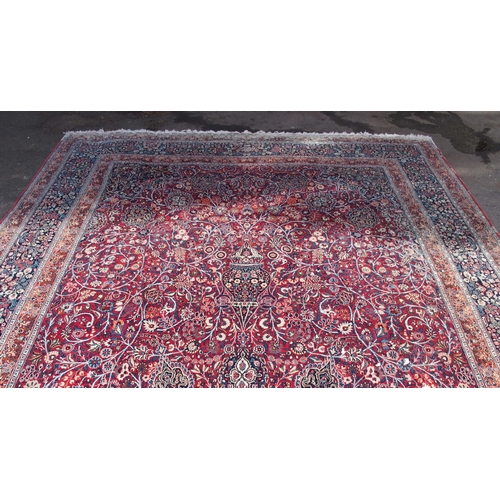 884 - AN EASTERN RED GROUND RUG