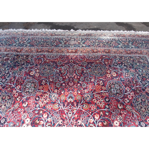 884 - AN EASTERN RED GROUND RUG