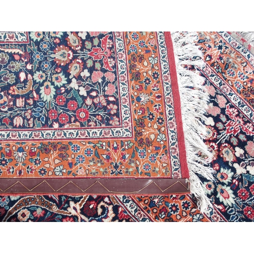 884 - AN EASTERN RED GROUND RUG