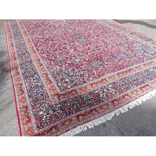 884 - AN EASTERN RED GROUND RUG