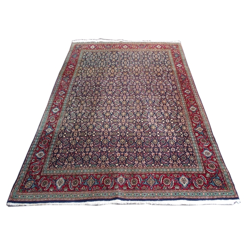 885 - A HAMADAN BLUE GROUND RUG