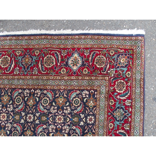 885 - A HAMADAN BLUE GROUND RUG