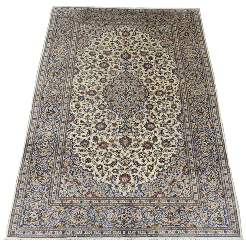 888 - A CREAM GROUND KASHAN RUG