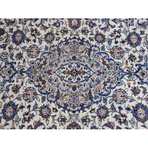 888 - A CREAM GROUND KASHAN RUG