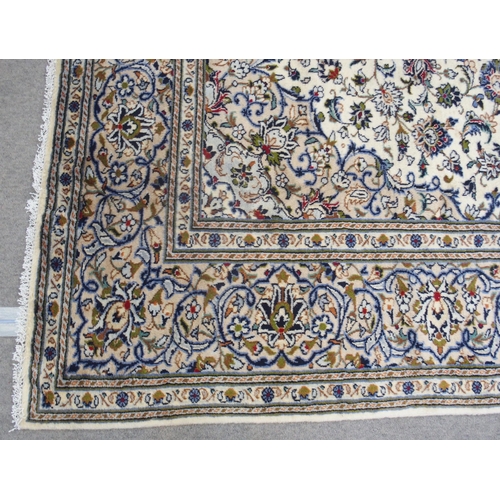 888 - A CREAM GROUND KASHAN RUG