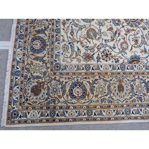 889 - A CREAM GROUND FINE KASHAN RUG