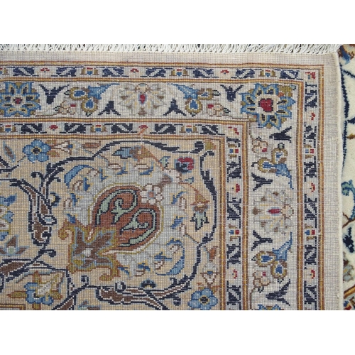 889 - A CREAM GROUND FINE KASHAN RUG