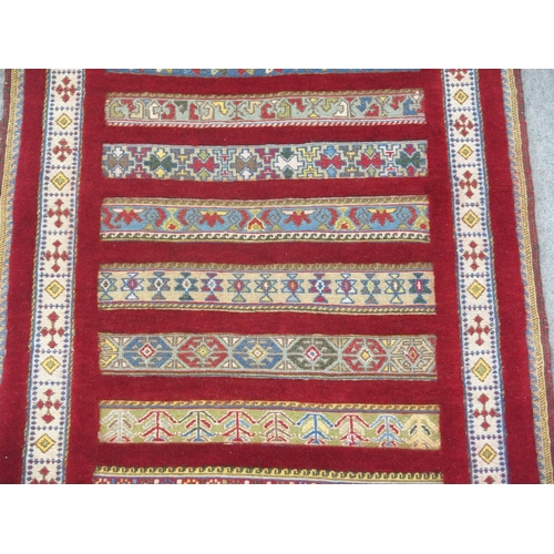 890 - A RED GROUND SOZANI RUG